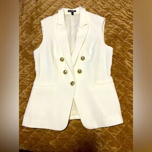 White lined vest. Very fine crepe fabric, well tailored. Fits like a gem.